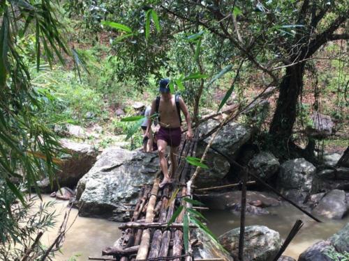 Passing a wooden bridge in the wilderness near Chiang Mai - Hubiwise Travels